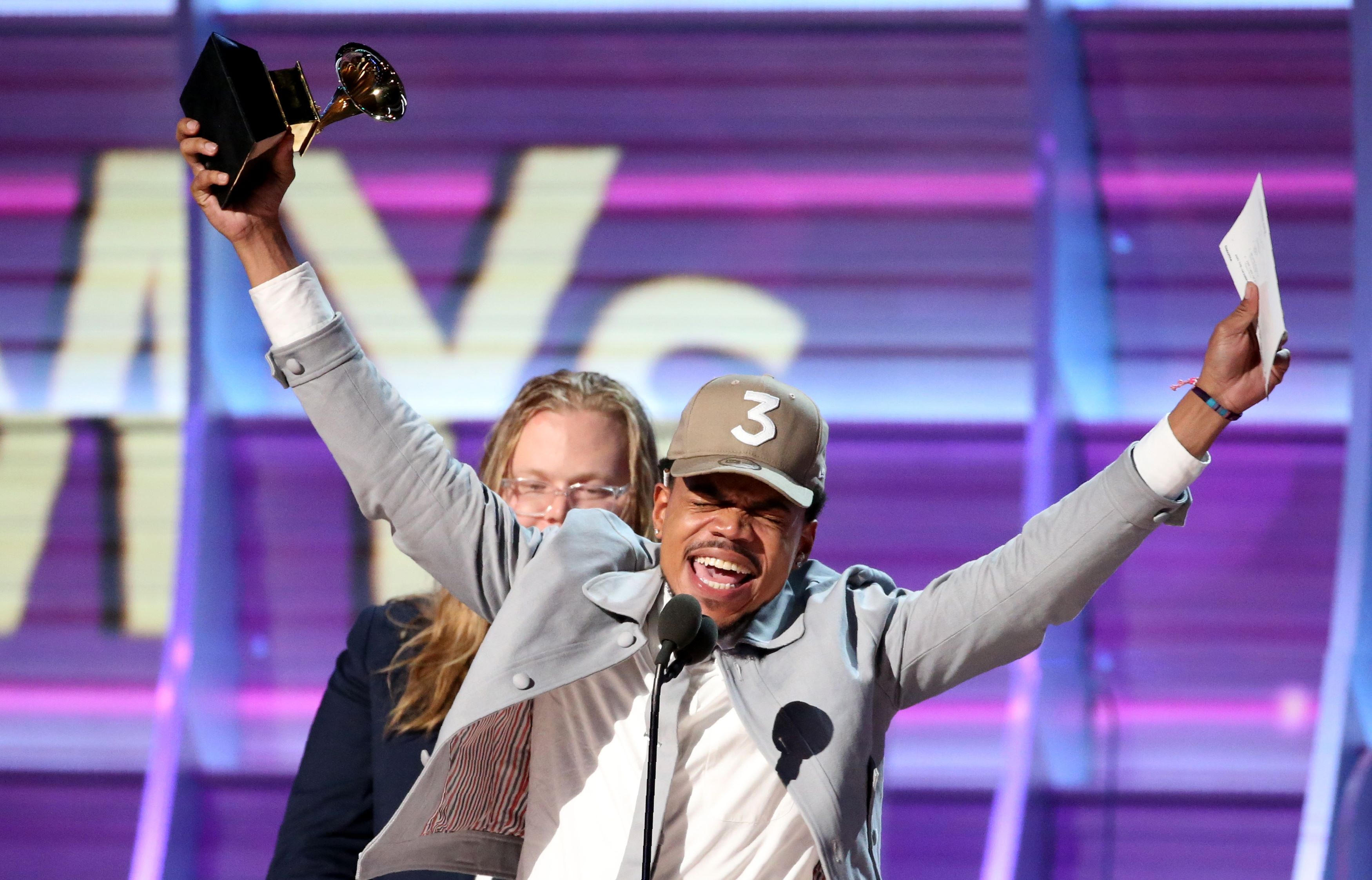 Chance the Rapper celebrates as he accepts the Grammy for Best Rap